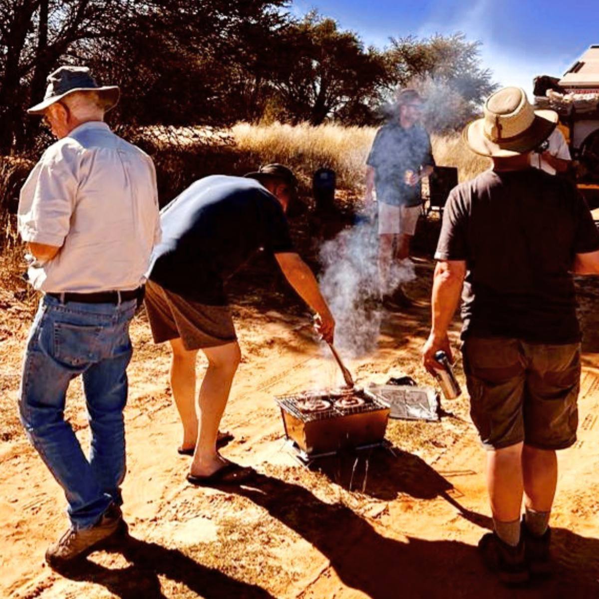 Flat Pack Deluxe Long Braai used during hunting trip outdoor wood fire cooking