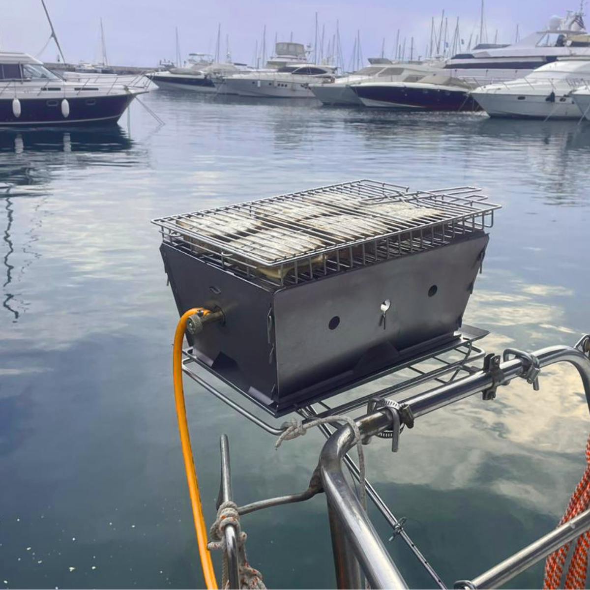 Flat Pack Deluxe Long Braai with gas add-on used for boat cooking setup